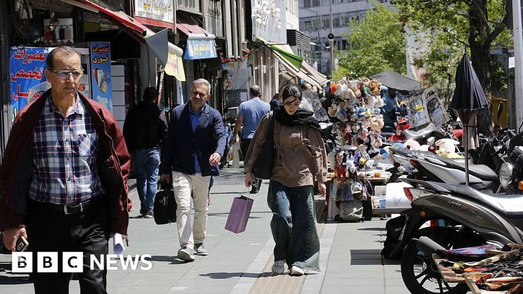 Daily life in Tehran continues - but money is short and risk of war looms