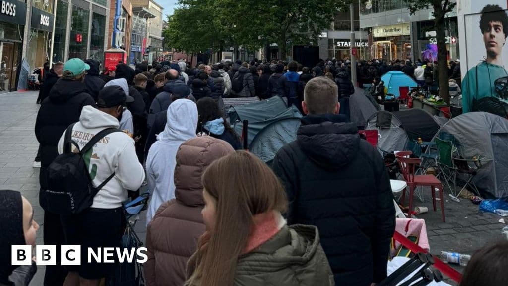 Massive queues shut Swatch stores as hundreds clamour for £335 limited edition watch