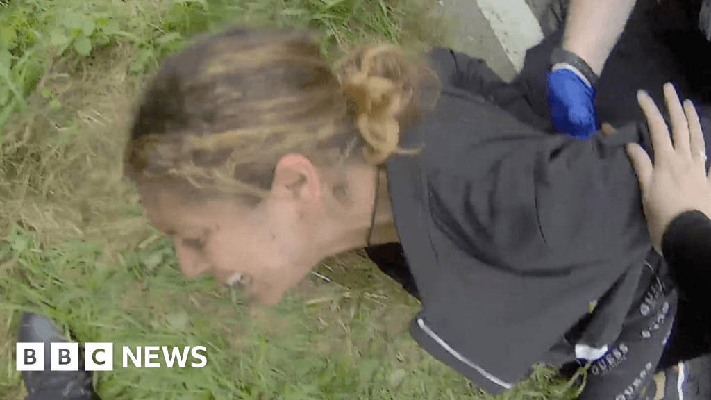 Video that police denied existed shows woman pinned down