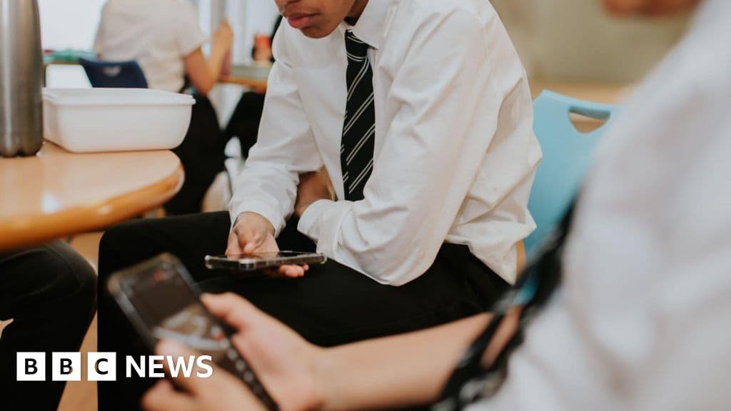 Phones to be banned in schools by law in England, government says