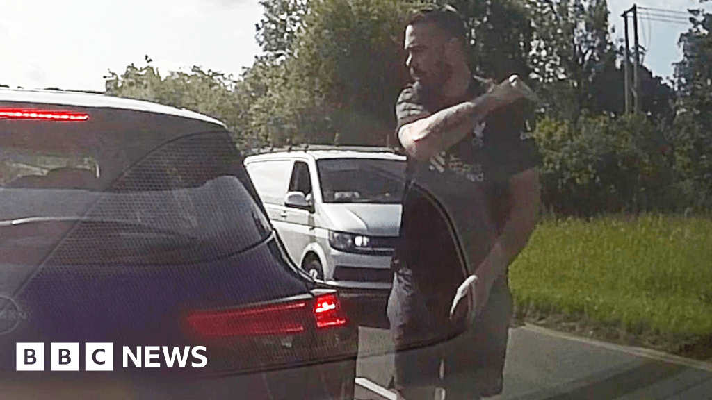 Road-rage driver caught on his own dashcam knocking motorist out