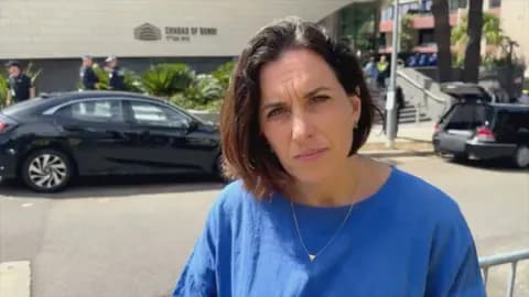 BBC correspondent Katy Watson standing outside the Chabad of Bondi