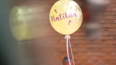 Yellow balloon with purple text reading "Matilda"