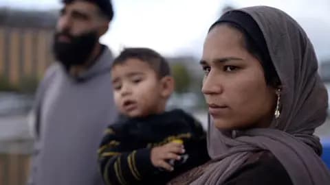 A mother and father and their young child