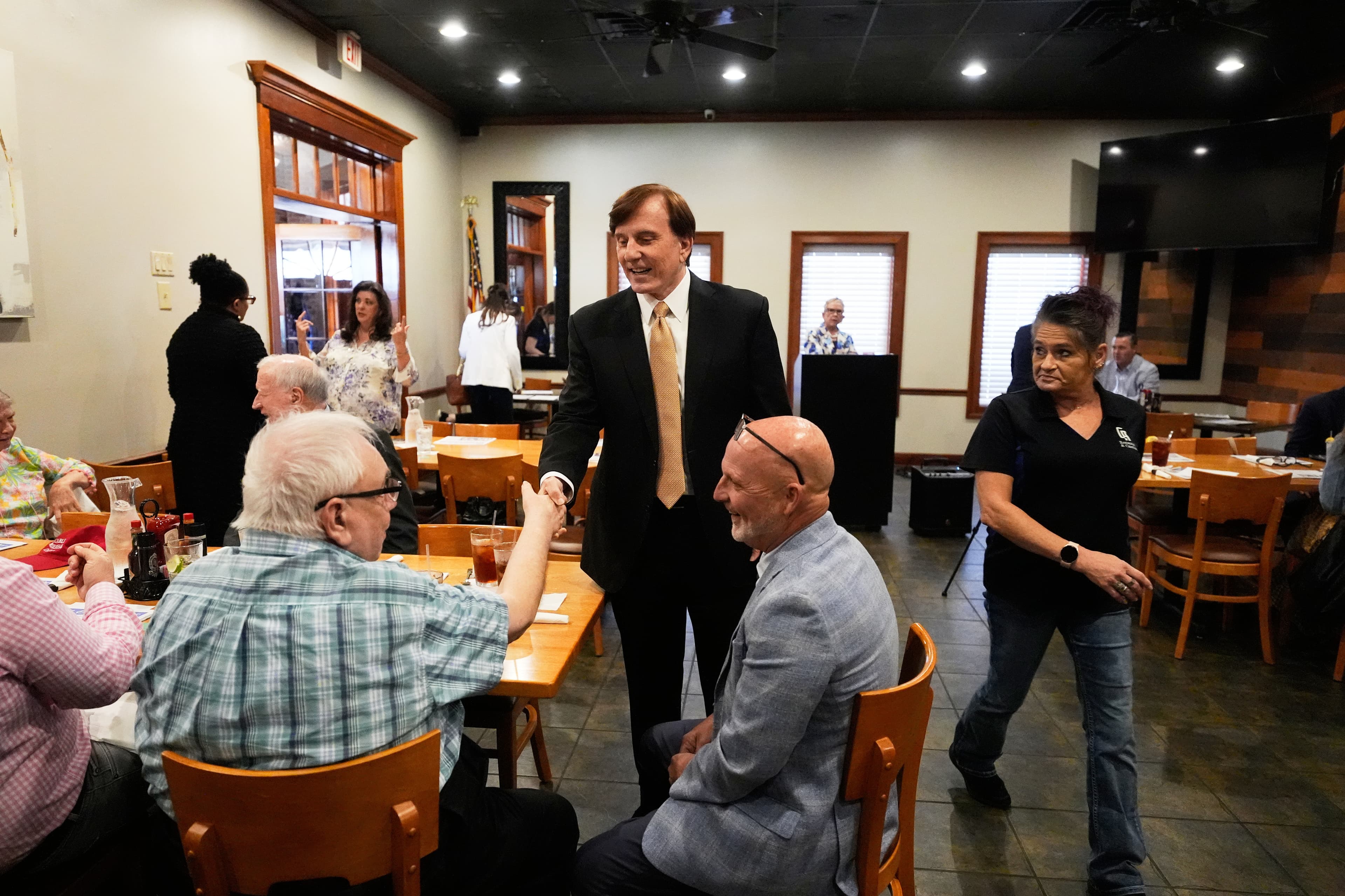 Senate candidate John Fleming greets supporters at a Ronald Reagan Newsmaker Luncheon in Baton Rouge, Louisiana, on May 12, 2026. 