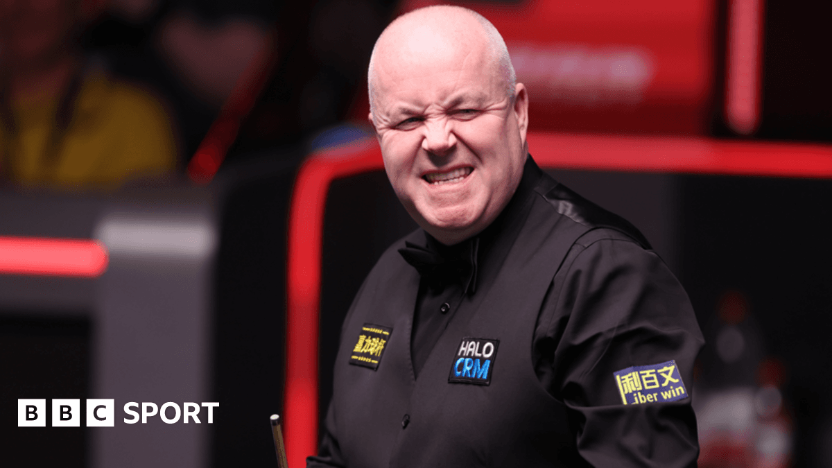 Higgins battles to level semi-final with Murphy
