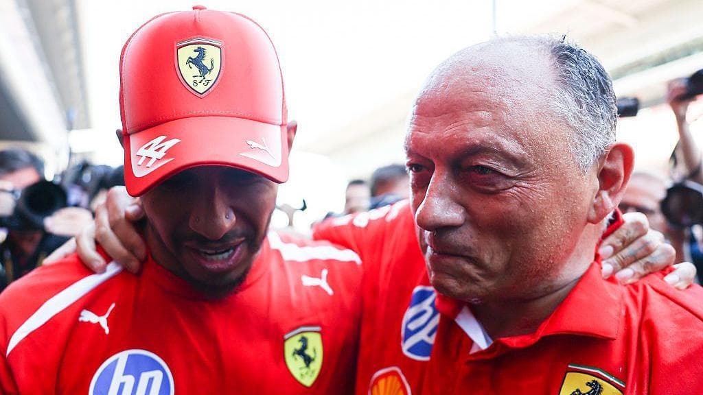 Lewis Hamilton and Ferrari boss Frederic Vasseur with their arms around each other
