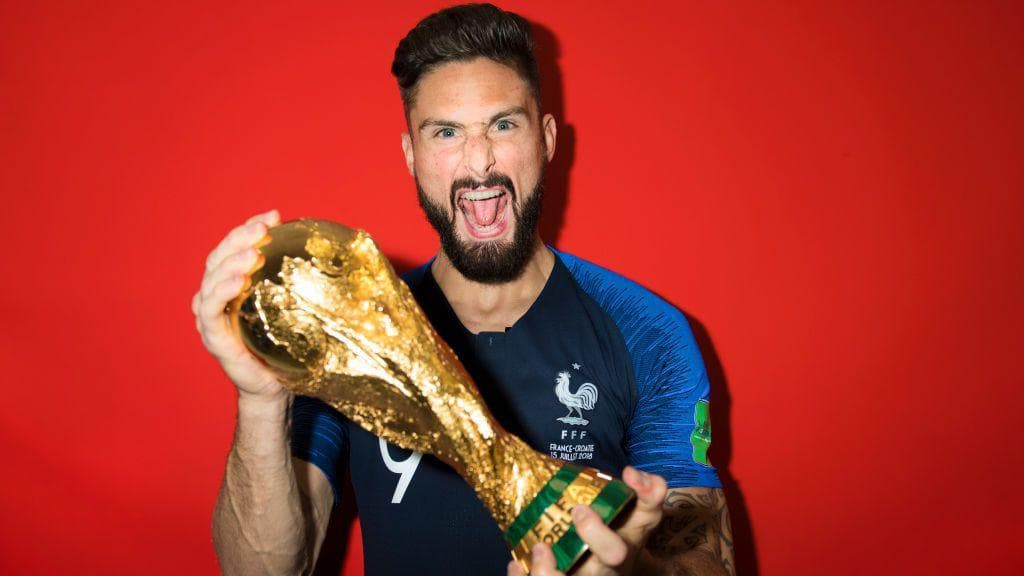 Olivier Giroud celebrates winning the World Cup trophy in 2018