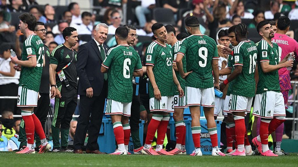 Mexico players drink near the touchline during the hydration break in the opening World Cup 2026 match against South Africa