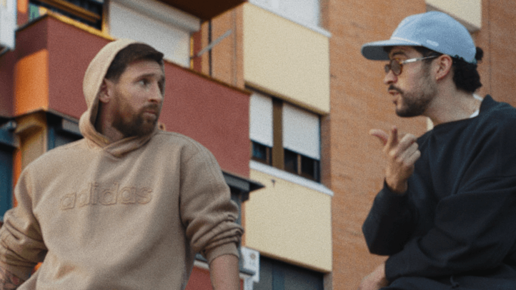 Lionel Messi and musician Bad Bunny are sitting on a car roof