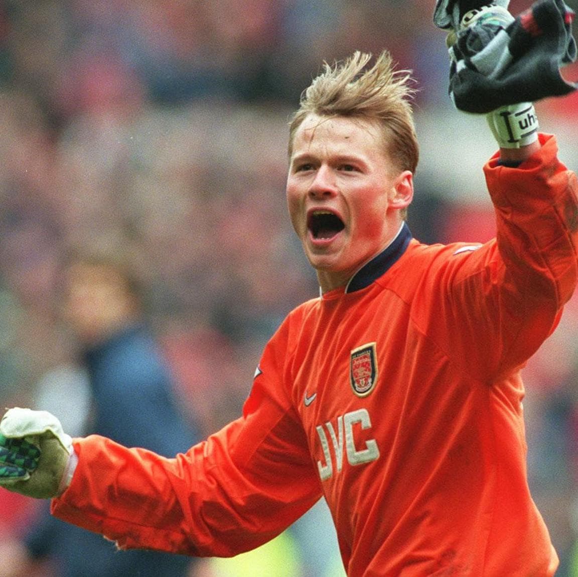 Manninger celebrates at full-time after Arsenal's 1-0 win at Old Trafford in March 1998