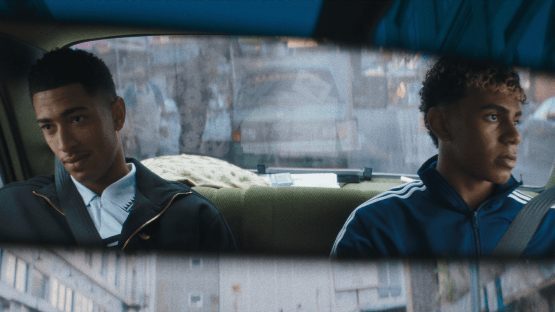 Jude Bellingham and Lamine Yamal are sitting in the back of a car in Adidas' World Cup advert.