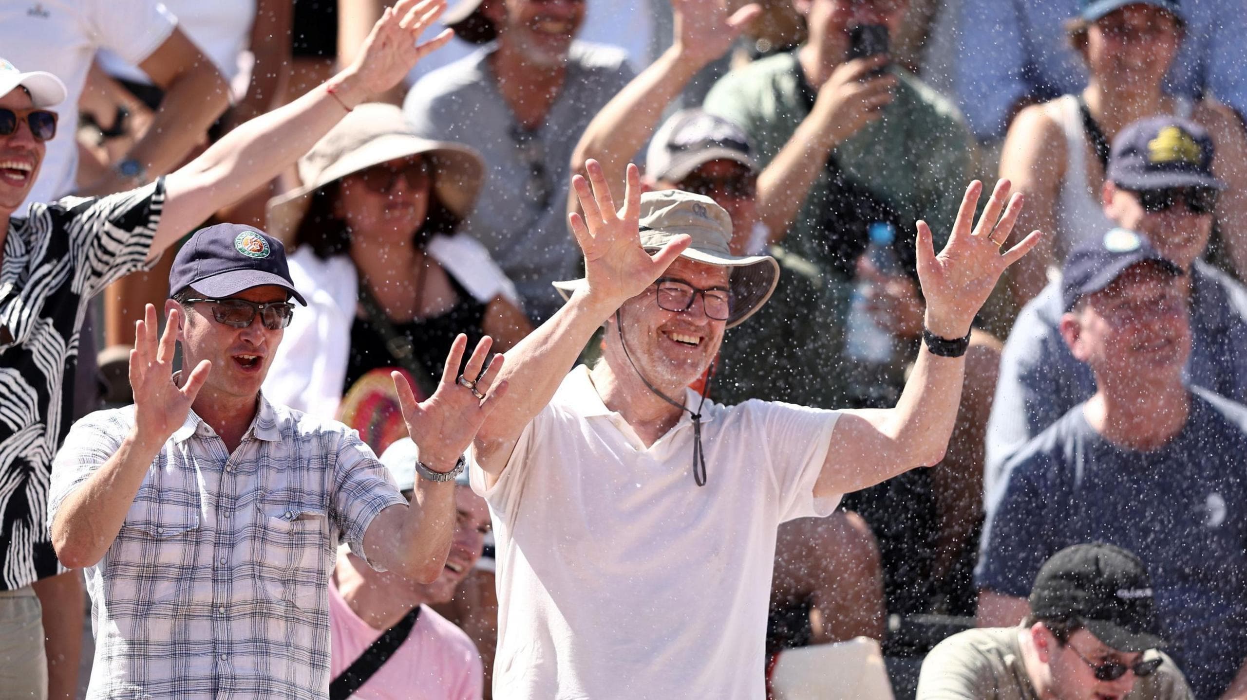 Fans get splashed by French Open sprinklers