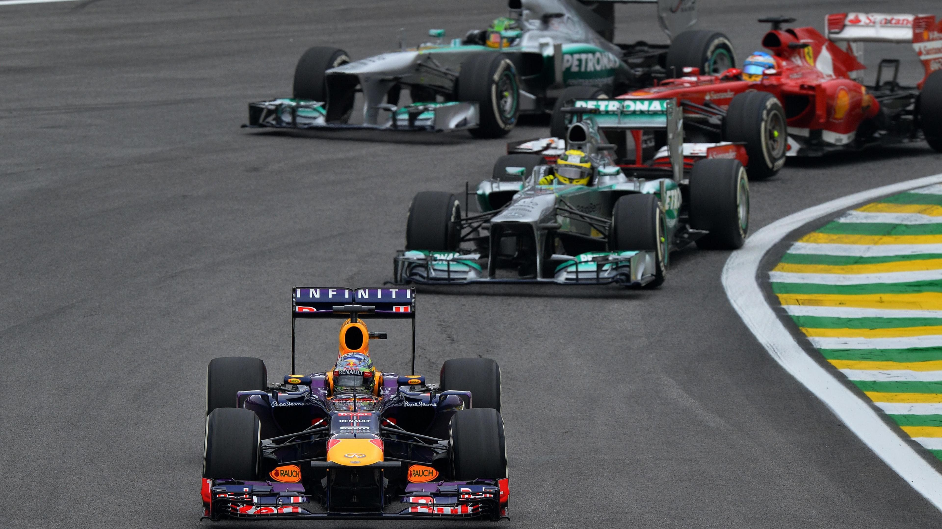 Red Bull's Sebastian Vettel leads the 2013 Brazilian Grand Prix from Mercedes' Nico Rosberg and Lewis Hamilton and Ferrari's Fernando Alonso