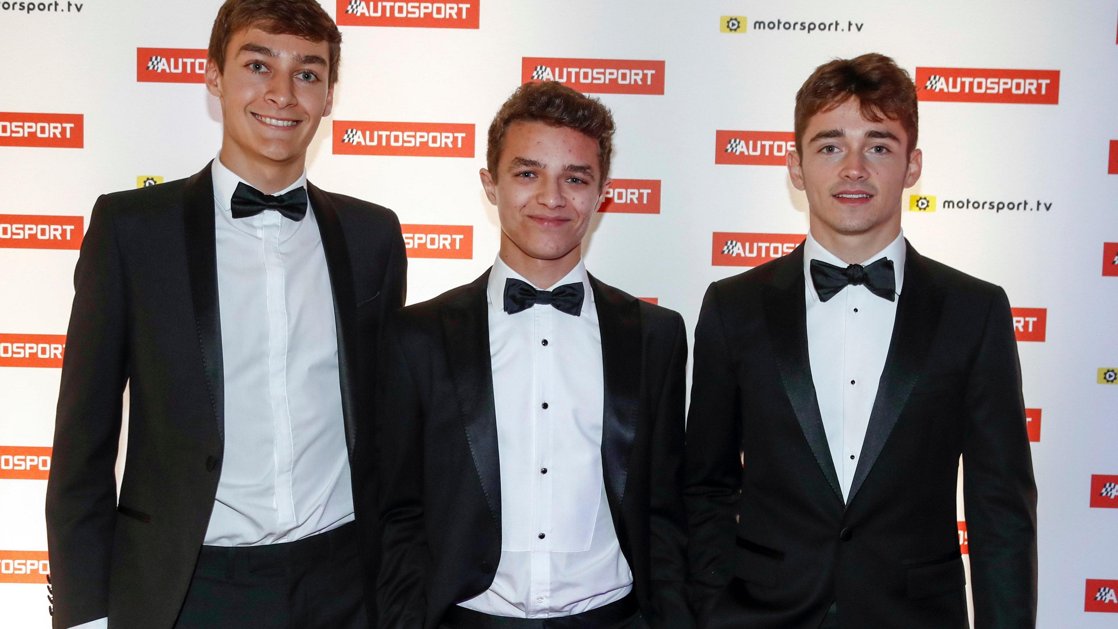 George Russell, Lando Norris and Charles Leclerc, wearing tuxedos, stood alongside each other at the 2017 Autosport Awards, when Leclerc was the F2 champion and Norris was the F3 champion