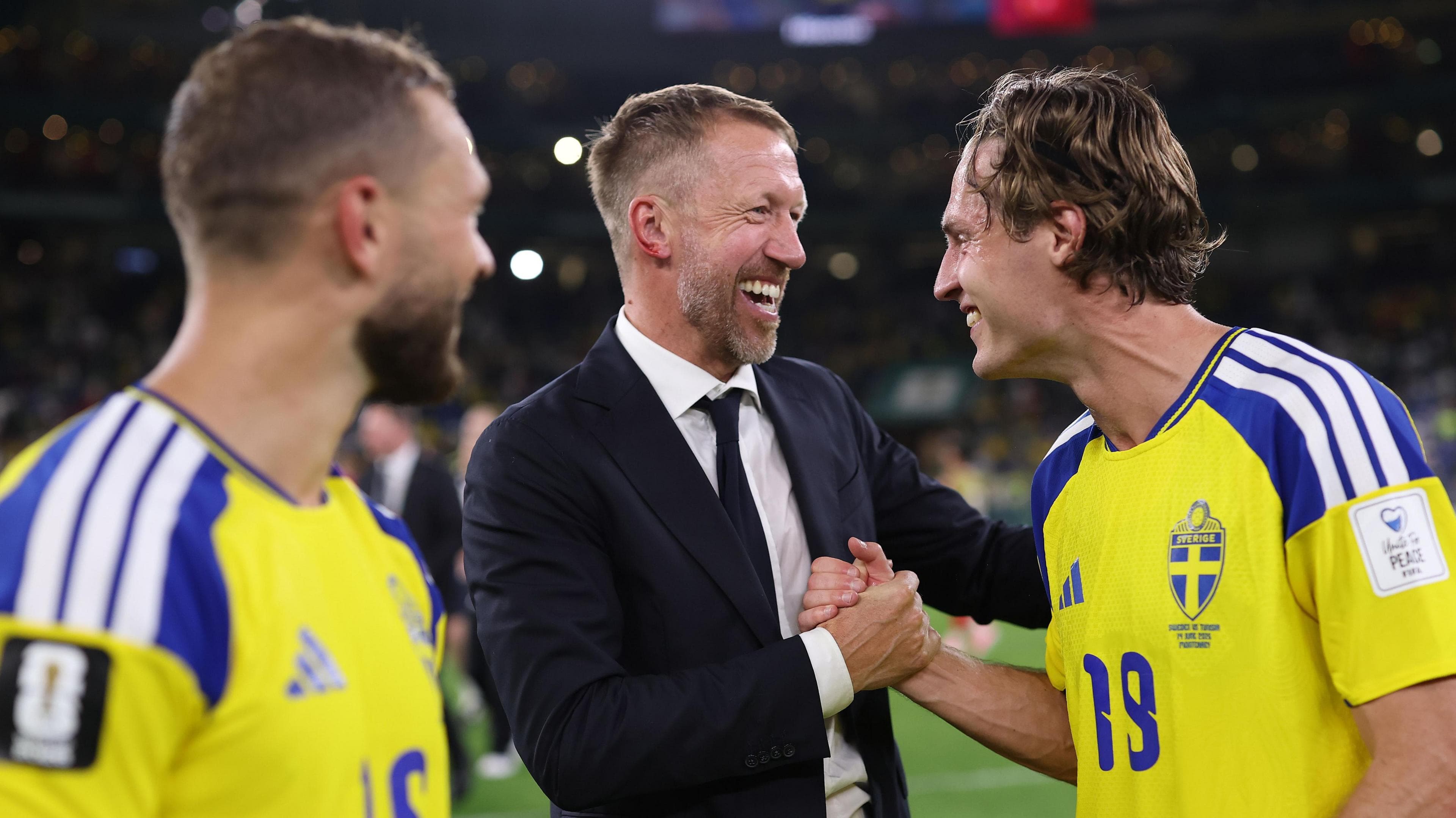 Graham Potter congratulates his Sweden players at full-time following their win over Tunisia