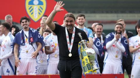 Players from Championship winners Leeds celebrate with manager Daniel Farke
