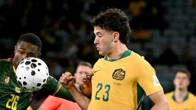 Alessandro Circati (right) challenges Cameroon's Christian Kofane