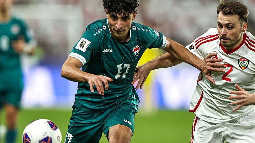 Iraq striker Ali Jasim (left) vies for the ball with UAE defender Ruben Canedo