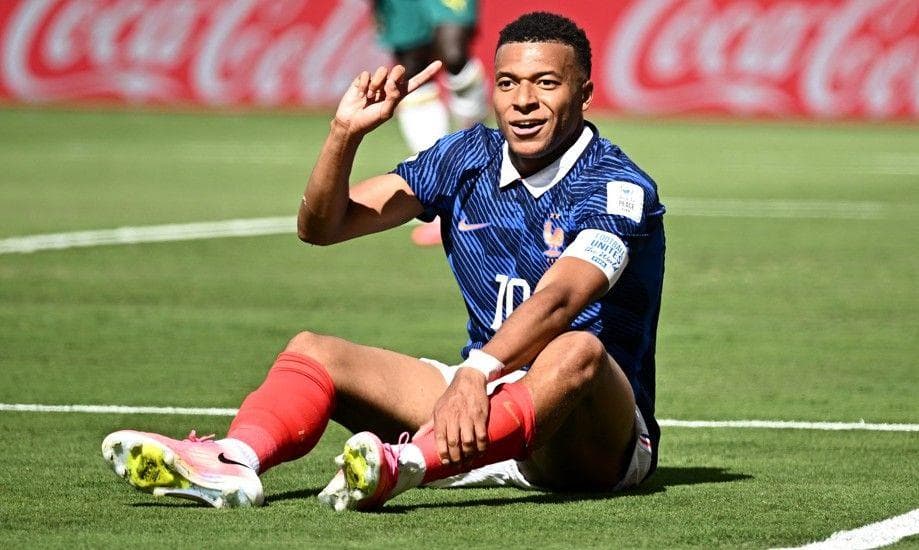 Kylian Mbappe reacts after a challenge by Sadio Mane inside the penalty area during France's game with Senegal at the World Cup