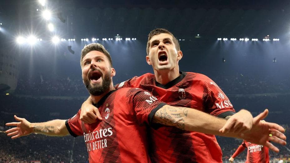 Olivier Giroud (left) and Christian Pulisic celebrate Giroud's goal for AC Milan against Paris St-Germain in 2023