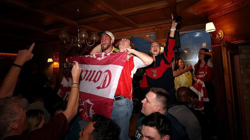 Arsenal fans celebrate the title win